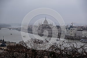 The Parliament in Budapest in a foggy winter day