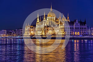 Parliament building of Budapest above Danube river in Hungary at night