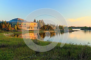 Northwest Territories Assembly Building on Frame Lake in Evening Sun, Yellowknife, Canada photo