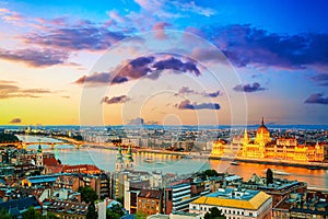 Parliament and riverside in Budapest, Hungary during colorful sunset