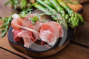 Parma ham, asparagus and arugula photo