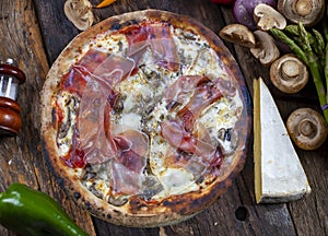 Parma ham pizza baked in the wood oven