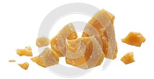 Parmesan cheese cut pieces isolated on white background