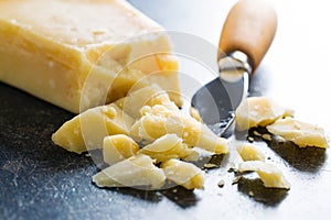 Parmesan cheese with knife photo