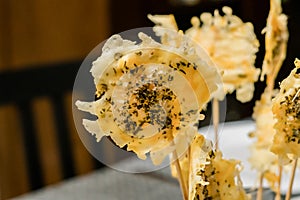 Parmesan cheese lollipops with oregano close up