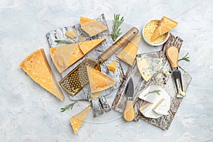 Parmesan. Cheeses set dor blu chedar camamber brie. Different types of cheese with knife on a light background. place for text,