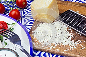 Parmesan and salad with chicken Caesar salad with micro-greens, cherry tomatoes on a blue ornament background