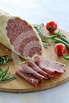 Parmesan Sausage on a white background. Close up