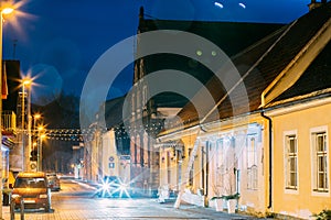 Parnu, Estonia. Night View Of Puhavaimu Street With Old Buildings, Restaurants, Cafe, Hotels And Shops In Evening Night