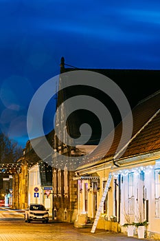 Parnu, Estonia. Night View Of Puhavaimu Street With Old Buildings, Restaurants, Cafe, Hotels And Shops In Evening Night