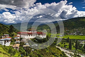 Paro Dzong and Paro valley with floating clouds , Paro , Bhutan