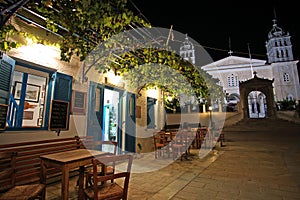 Paros, Greece, 14 September 2018, Traditional night view of a bar with its beautiful pergola