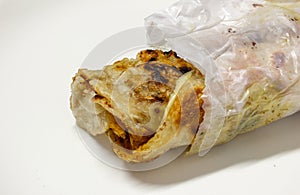 Parotta roll which is a common street food in south india. Partotta is a layered flatbread made out of maida flour photo