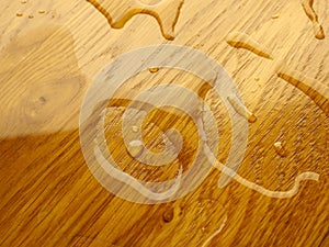 Parquet. Water drops on wooden surface.