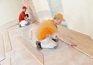 Parquet workers at flooring work