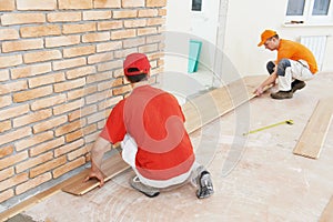 Parquet workers at flooring work