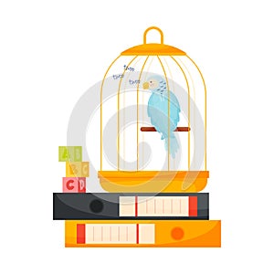 Parrot cage and cactus on books pile. Education concept.