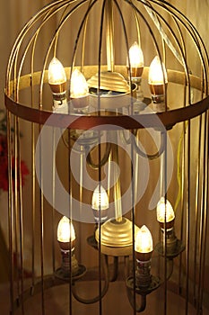 Parrot cage shaped modern chandelier glowing