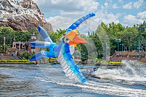 Parrot shaped Kite flying through the air