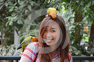 Parrots on a girl head