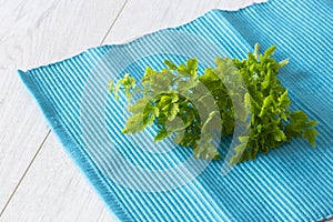 Parsley freshly picked and organic on a blue tea towel