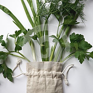 Parsley and green onions flat lay in a cloth bag on a white background