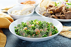 Parsley tabbouleh with tomato and cous cous photo