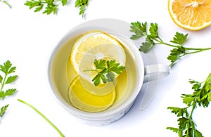 Parsley tea with lemon and lime slices