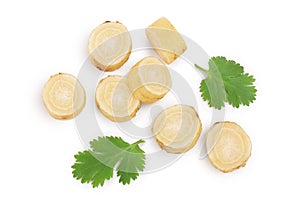 Parsnip root slices with parsley isolated on white background with clipping path. Top view. Flat lay