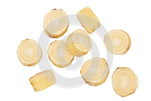 Parsnip root slices with parsley isolated on white background with clipping path. Top view. Flat lay