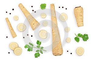 Parsnip root and slices with parsley peppercorns isolated on white background with clipping path. Top view. Flat lay