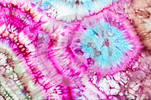Part of abstract bright pattern in tie-dye batik