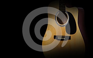 Part of acoustic guitar on old black background