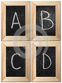 Part of the alphabet drawing with chalk on the old scratched chalkboard background with wooden frame. Letters: A, B, C