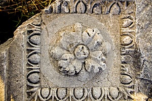 Part of ancient building, ornate block from Nicaea Iznik Ancient City. Flower shape and frame photo