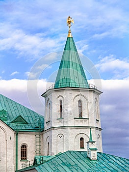 Architectural detail of the Ratnaya Chamber complex with a turret, a three-headed eagle on a spire in Tsarskoe Selo in