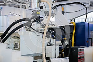 Part of automatic plastic injection molding machine during work