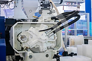 Part of automatic plastic injection molding machine during work