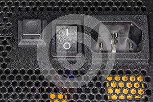Part of back face of computer power supply close-up