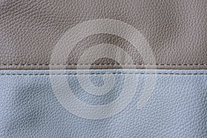 Part of a bag of beige and white leather, horizontal image