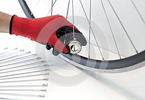 part of a bicycle wheel, adjusting the spokes of the wheel with a tool