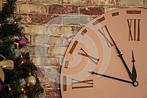 Part of the big clock clock on the wall near the Christmas tree. The arrows indicate the time of the New Year`s approach