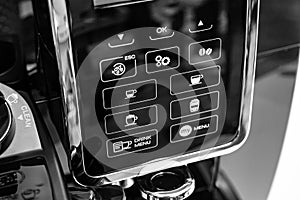 part of black coffee machine with program buttons. a device for making coffee.