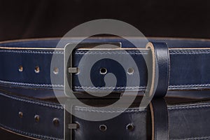 Part of a blue leather belt