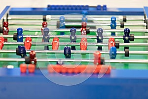 Part of a blue table football and display 2 hits