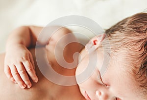 The Part of Body and Face of Newborn Baby with Small Touching Ha