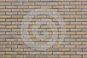 Part of brick wall with yellow bricks