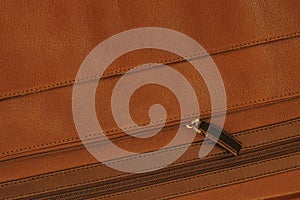 Part of Briefcase from genuine leather with pocket, zipper close-up, texture, background