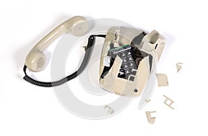 Part of a broken old telephone, phone with dial plate - plastic phone