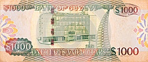 Part of brown Guyana 1000 dollars Banknote fragment